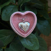 White gold locket necklace with an engravable heart pendant.