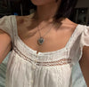 Stylish and romantic white gold love locket necklace with a dainty design