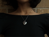 High-quality white gold-plated heart locket with a polished finish