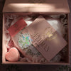 Luxury gift set including a gold heart locket and cozy love pillow