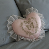 Sentimental pink heart pillow with delicate lace details