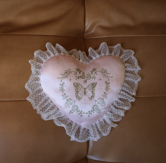 Cottagecore-inspired pink love pillow, soft and dreamy.